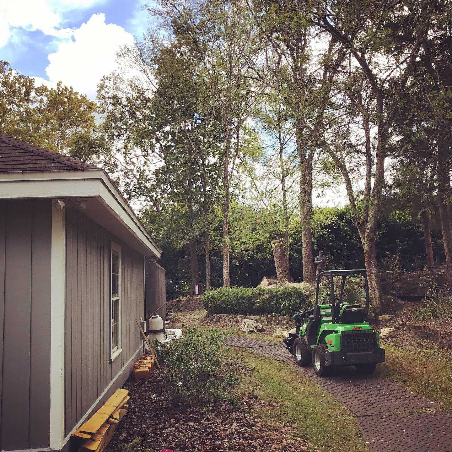 An avant wheel loader at rest on turf protecting footers after a successful job.