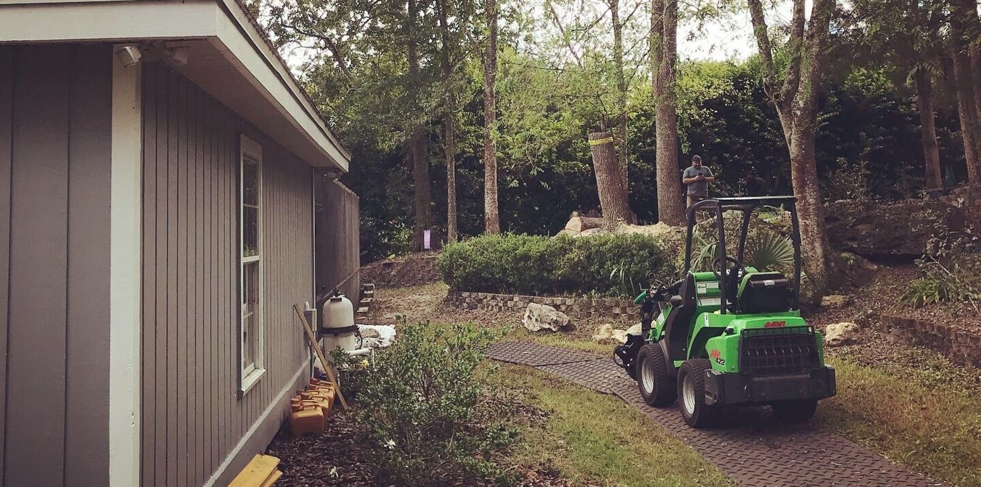 An avant wheel loader at rest on turf protecting footers after a successful job.