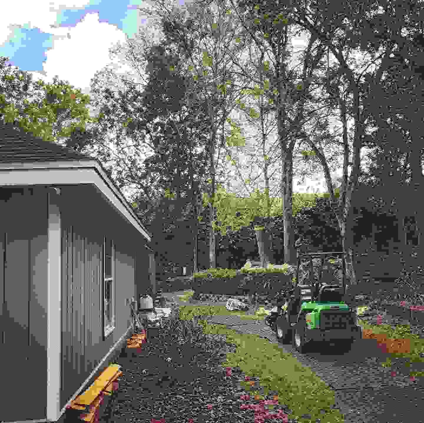 An avant wheel loader at rest on turf protecting footers after a successful job.